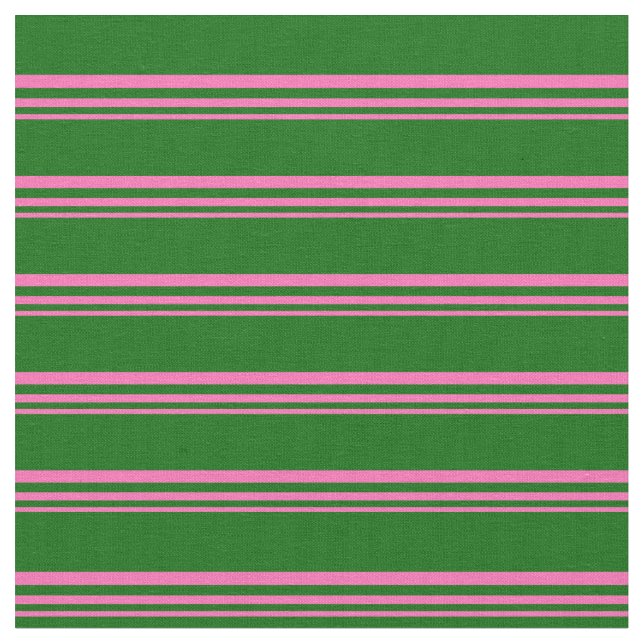 Warmes rosa und dunkelgrünes Muster Stoff (Nahaufnahme)