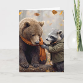 Waschbär bindet einem Bären einen Schal um Karte