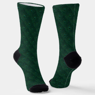 Wasser tropft auf grünem Metall Socken