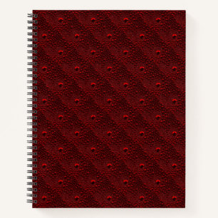 Wassertropfen auf Krimsonmetall Notizbuch