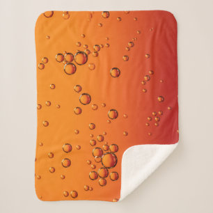 Wassertropfen auf orangefarbener Oberfläche Sherpadecke