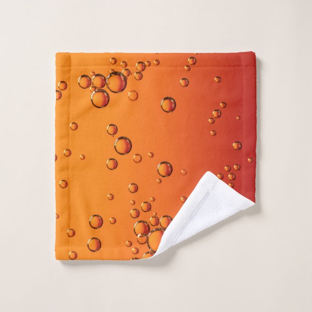 Wassertropfen auf orangefarbener Oberfläche Waschlappen (Waschlappen)