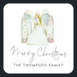 Watercolor Angel Merry Christmas Script Quadratischer Aufkleber<br><div class="desc">Watercolor Engel Frohe Weihnachtsschrift. Eine wunderschöne Engel- und Fensterszene,  und Fröhliche Weihnachten in einem eleganten Set Handschrift Stil Skript Einfach personalisieren Sie Ihren Namen.</div>