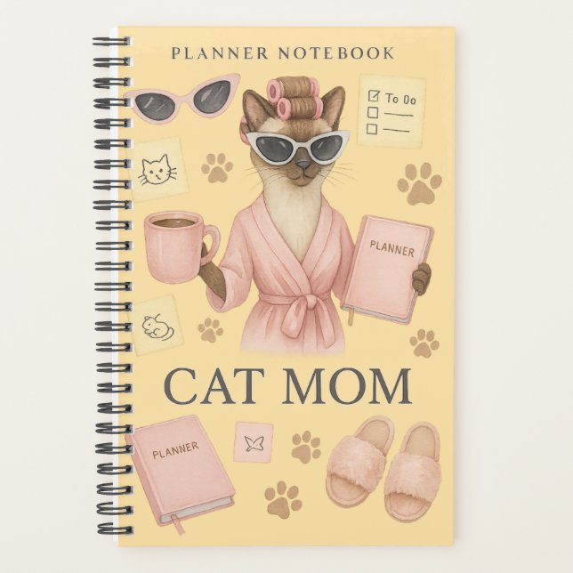 Weibliche Katze hält Terminkalender Planer (Vorderseite)