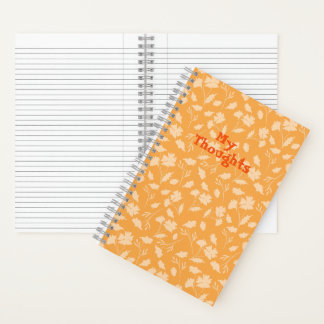 Weiche Blumenmuster auf orangefarbenem Hintergrund Notizbuch