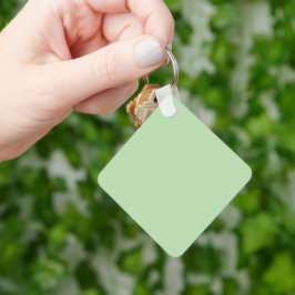 Weicher, blassgrüner Hintergrund mit subtiler Vert Schlüsselanhänger