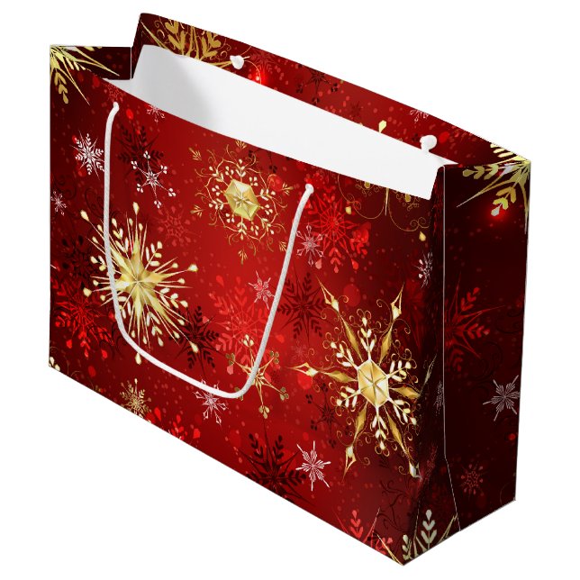 Weihnachten Goldene Schneeflocken im roten Hinterg Große Geschenktüte (Vorderseite Schrägansicht)