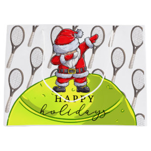 Weihnachten im Tennis mit Ball und Racket mit Sant Große Geschenktüte
