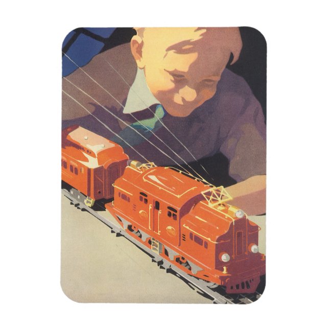 Weihnachten, Junge spielen mit Spielzeugbahnen Magnet (Vertikal)