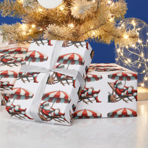 Weihnachten mit Santa unter einem Strandsonnenschi Geschenkpapier