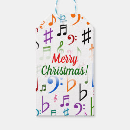 Weihnachten; viele farbenfrohe Musiknoten und Symb Geschenkanhänger