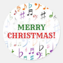 Weihnachten; viele farbenfrohe Musiknoten und Symb