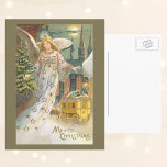 Weihnachten, Viktorianischer Engel mit Baum Feiertagspostkarte<br><div class="desc">Vintage Illustration religiöses Viktorianisches Weihnachtsbild mit einem Engel mit Flügeln und einem Dachstuhl mit goldenen Sternen schwebt und hält einen Weihnachtsbaum. Eine Engelfrau mit Kirche,  Kutsche und Vollmond im Hintergrund. Im Text steht "Frohe Weihnachten".</div>
