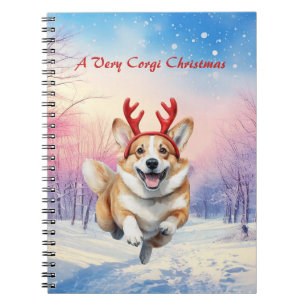 Weihnachts-Corgi-Rentierfischer springen im Schnee Notizblock