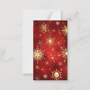 Weihnachts-Goldschneeflocken auf rotem Hintergrund Mitteilungskarte