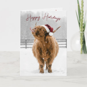 Weihnachts Highland-Kuh leckt Schneeflocken Karte