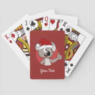 Weihnachts-Koala-Cartoon spielt Karten Spielkarten