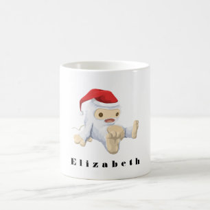 Weihnachts-Monster-Puppe mit roter Weihnachtsmannm Kaffeetasse
