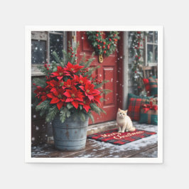 Weihnachts-Poinsettias und weiße Katze vor der Hau Serviette