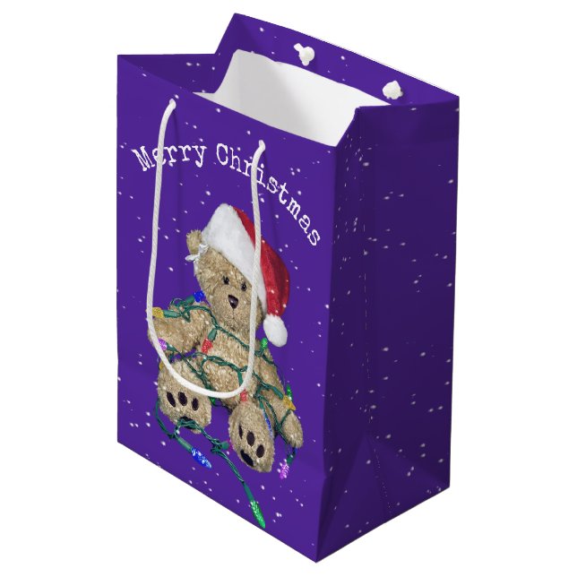Weihnachts-Teddy-Bär in getrübten Lichtern Mittlere Geschenktüte (Vorderseite Schrägansicht)