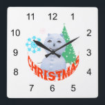 Weihnachtsbaum und Schneemann Quadratische Wanduhr<br><div class="desc">Foto eines Schneemanns, zeichnend von einem Weihnachtsbaum und zwei Schneeflocken, Rottext Weihnachten. Drucke, T - Shirt und Geschenke für Spaß und gute Laune. Weihnachten und Neujahr genießen</div>