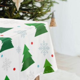 Weihnachtsbaumwald, Schneeflocken und roter blauer Tischdecke