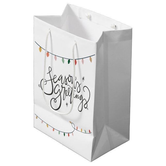 Weihnachtsbeleuchtung - die Grüße der Jahreszeit Mittlere Geschenktüte (Vorderseite Schrägansicht)