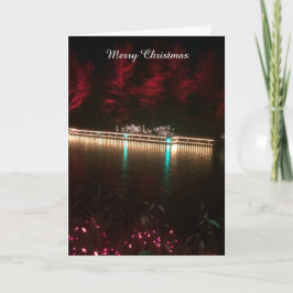 Weihnachtsbeleuchtung und farbenfrohe Bäume Feiertagskarte