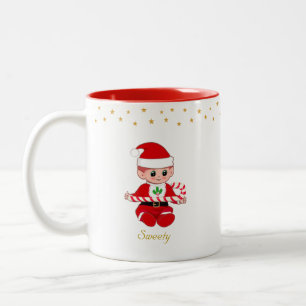 Weihnachtself mit Zuckerrohr, goldenen Sternen und Zweifarbige Tasse