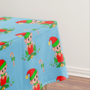 Weihnachtself und Zuckerstange auf Hellblau Tischdecke