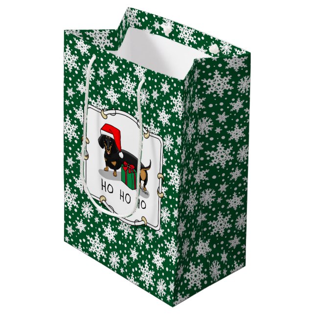 Weihnachtsfeier Dackel (schwarz & braun) Funny Mittlere Geschenktüte (Vorderseite Schrägansicht)