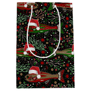 Weihnachtsfisch in Santa-Hüten Roter und grüner Fo Mittlere Geschenktüte
