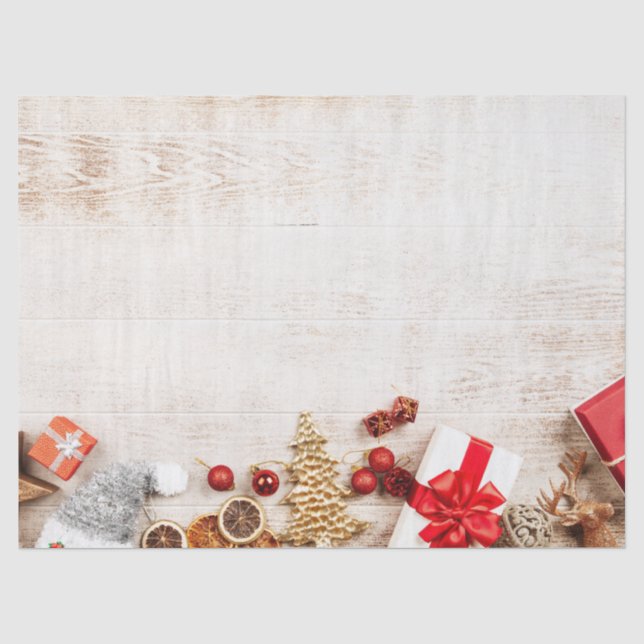 Weihnachtsgeschenkartikel auf einem rustikalen Hol Seidenpapier (Vorderseite)