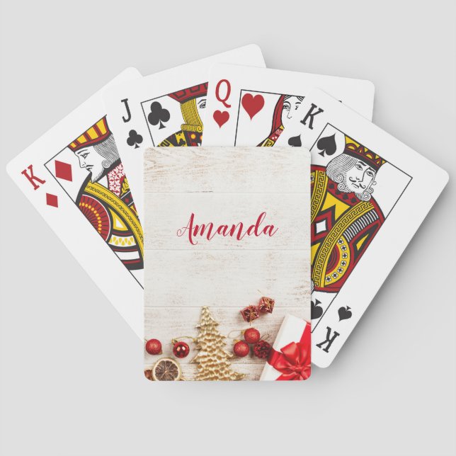 Weihnachtsgeschenkartikel auf einem rustikalen Hol Spielkarten (Rückseite)
