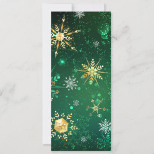 Weihnachtsgoldschneeflocken auf grünem Hintergrund Einladung