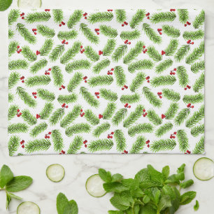 Weihnachtsgrüne Tannenzweige und rote Beeren auf W Geschirrtuch