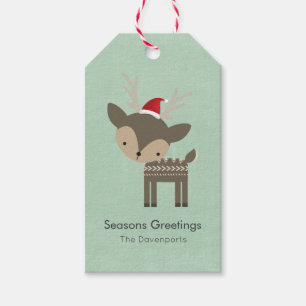 Weihnachtshirsche in einem Retro-Hipster der roten Geschenkanhänger