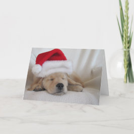Weihnachtsjunge Weihnachtsmannmütze Feiertagskarte
