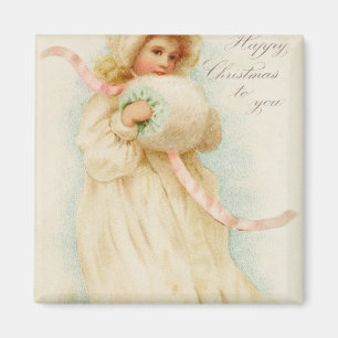 Weihnachtskarte, die ein Mädchen mit einer Muffe Magnet