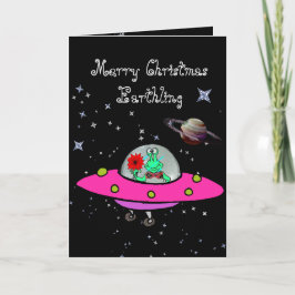 Weihnachtskarte mit Alien in einem Raumschiff und  Feiertagskarte