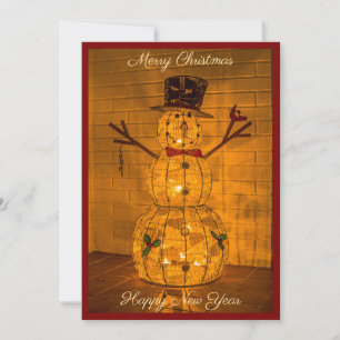 Weihnachtskarte mit leuchtendem Schneemann Feiertagskarte