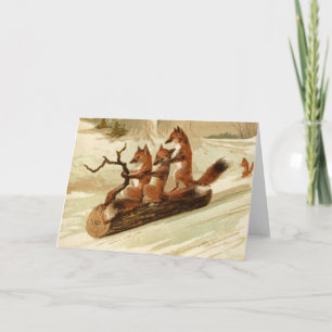 Weihnachtskarte mit Vintage-Füchsen beim Schlitten Feiertagskarte