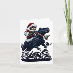 Weihnachtskatze in Santa-Hut hält eine Waffe und D Karte