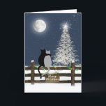 Weihnachtskatzen auf Zaun Feiertagskarte<br><div class="desc">Katzen auf einem hölzernen Zaun mit fröhlichen Weihnachtszeichen und Urlaubsleuchten,  die auf den Mond bzw. den weißen Kiefern blicken.</div>