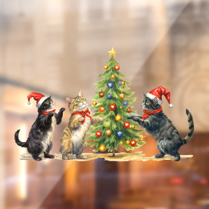 Weihnachtskatzen feiern rund um den Weihnachtsbaum Fensteraufkleber