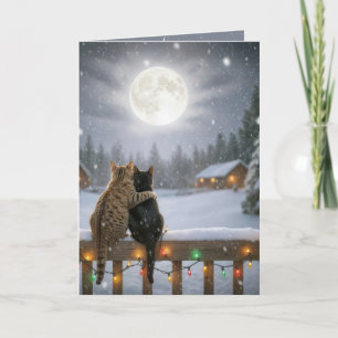 Weihnachtskatzen kuscheln auf einem schneebedeckte karte