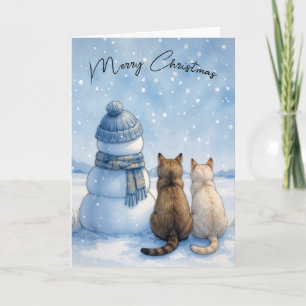 Weihnachtskatzen sitzen mit einem Schneemann auf e Karte