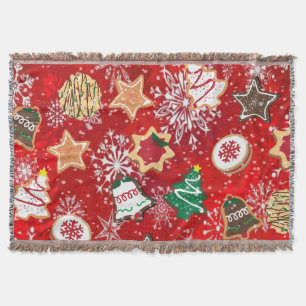 Weihnachtskekse und Schneeflocken auf Rot Decke