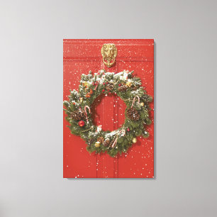 Weihnachtskranz an einer Tür Leinwanddruck
