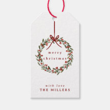 Weihnachtskranz mit rotem Bogen auf weiß